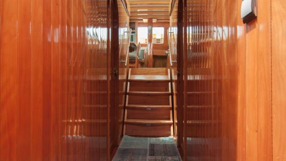 Elegant wood-paneled hallways on Gulet Nikola. Access to cozy cabins.