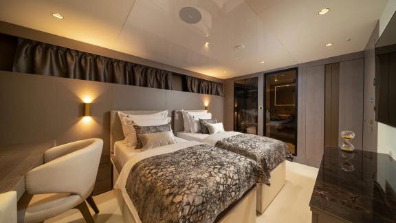 Modern and elegant twin bedroom on Nocturno with stylish decorative elements.