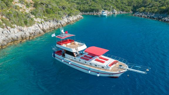 Relax on the luxurious Ok Ay in a tranquil bay of Fethiye with 3 cabins for up to 6 people.