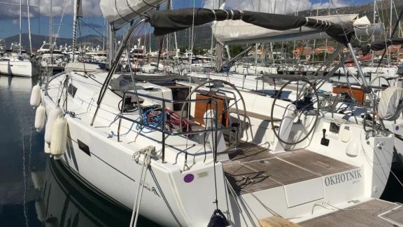 The aft deck of the Okhotnik yacht features the helm area and deck equipment.