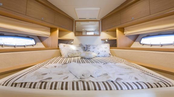 The double cabin of Silver Arrow in Split features a spacious bed, side windows and comfortable yacht accommodation.
