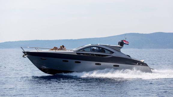 Silver Arrow cruises off the coast of Split, showcasing sporty styling and an exclusive yacht charter experience.