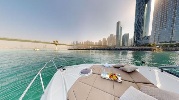 Pershing 5X White combines luxurious yacht rental with the stunning cityscape of Dubai.