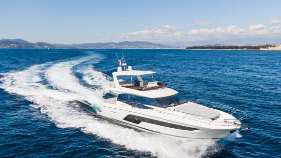 Esperanza Prestige 590 motor yacht is cruising along the French coast offering a luxury yacht charter holiday at sea.