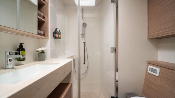Among catamaran rental options Princess Karla shower cabin and sink area provide a clean and functional bathroom space.