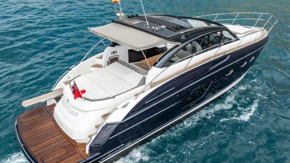Among Monaco daily yacht charter options Belle Vie motor yacht shows aft deck seating and swim platform.