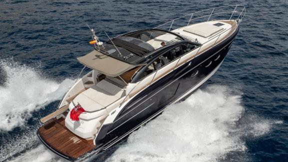 Among Monaco daily yacht charter options Belle Vie motor yacht shows top rear cruising view with spacious deck.