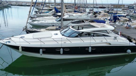 Among Monaco yacht rental options Nous motor yacht is seen docked in marina with elegant design.