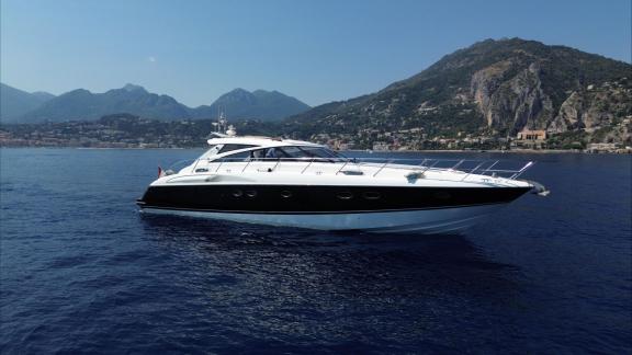 Among Monaco yacht rental options Nous motor yacht is seen cruising calmly on open sea.
