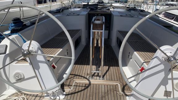 The wide cockpit of the Procyon sailing yacht offers a comfortable experience with dual helm steering.