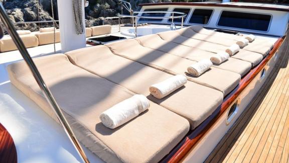 Sunbathing areas on the deck of the Queen Lila, perfect for relaxing in the sun.