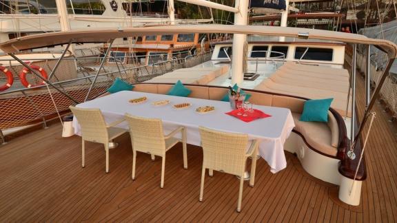 Dining area on the deck of the Queen Lila, ready for al fresco dining.