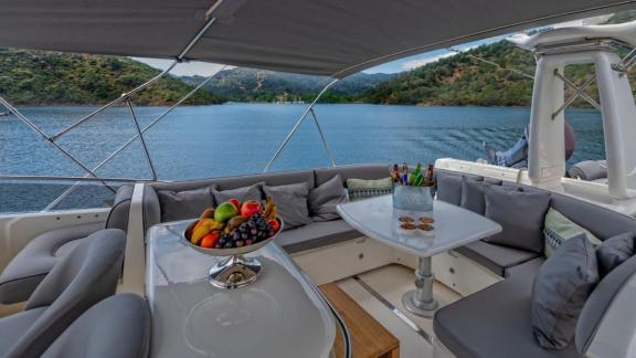The cozy seating area on the River S motor yacht offers an ideal setting for relaxation with stunning views.