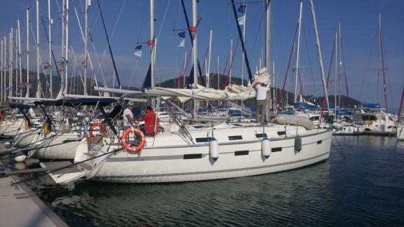 Sailing yacht Almina is being prepared for sailing in the marina.