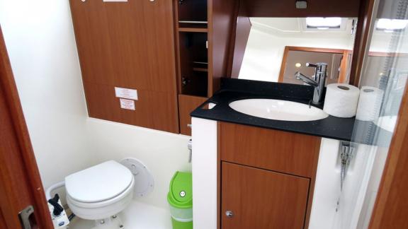 The bathroom of sailing yacht Almina features modern fixtures and a hygienic environment.