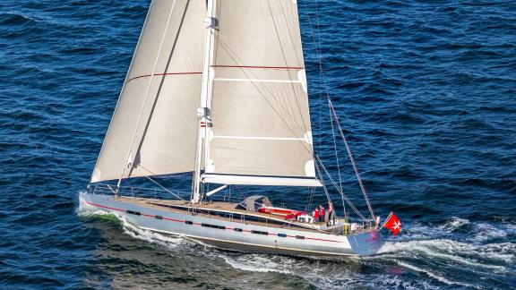 The sailing yacht Bellkara Conrad Shipyard YCC91 showcases elegant full‑sail movement across deep blue waters.