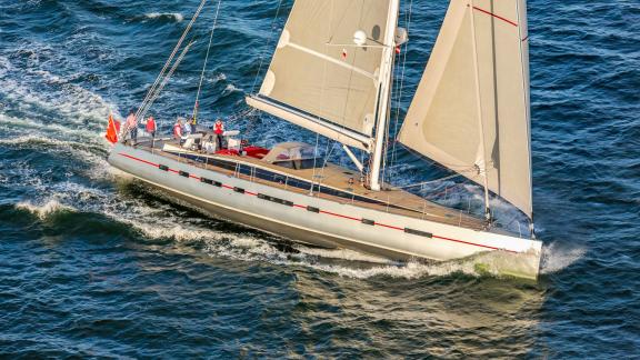 The sailing yacht Bellkara, a Conrad Shipyard YCC91, glides across the waves with full sail and elegance.