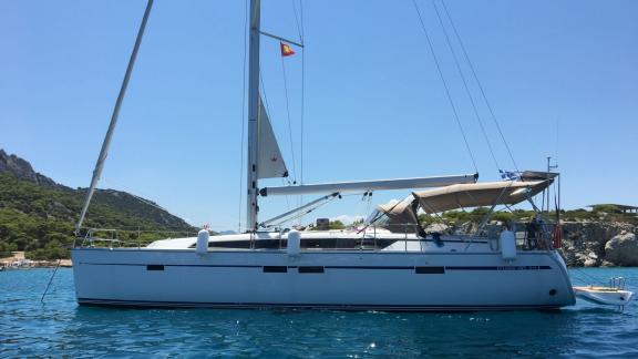 The Faethon sailing yacht is anchored in open sea, offering a peaceful view of the calm blue waters.