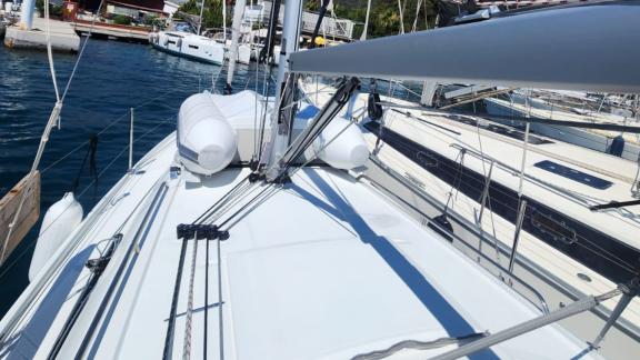 The deck of the Lima sailing yacht is clearly visible while docked in the marina.