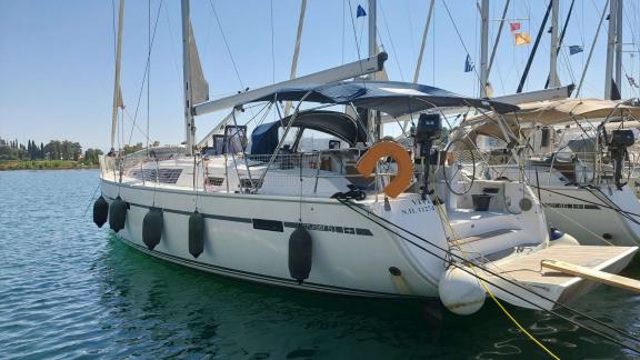 Exterior view of the sailing yacht Vivi, docked with clear visibility of the deck and living areas.