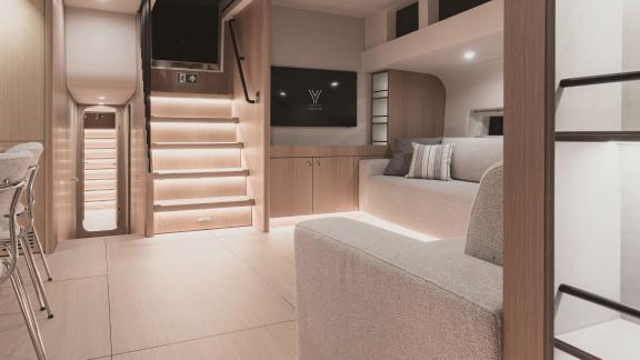 Modern interior of the yacht Nadamas with a stylish staircase and well-thought-out lighting.