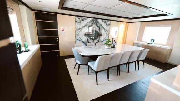 Elegant dining area of Princess Melda yacht with a large table and comfortable chairs.