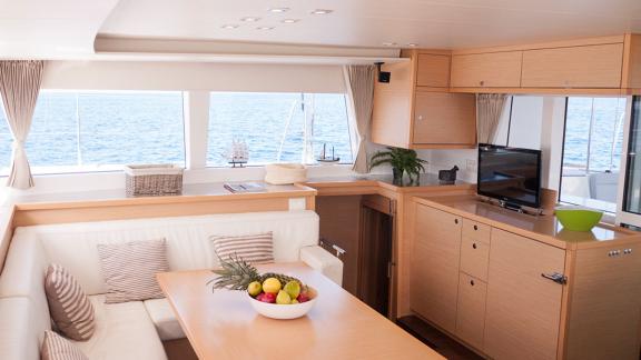 The salon of the Balok catamaran offers a spacious seating area with sea views and a modern design.