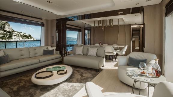 Relax in the elegant and modern living area of the luxurious motor yacht Volante with a sea view.