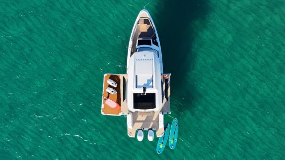 Motor yacht Bali, seen from above, offers a relaxing experience with water sports gear in the sea.