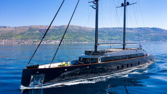 Among Split yacht charter options the 6 cabin 12 guest Scorpios motorsailer cruising at sea.