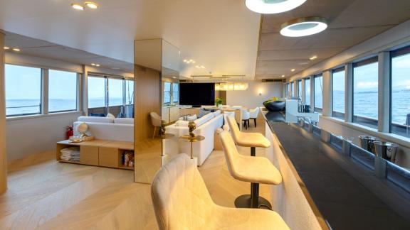 Among Split luxury yacht options the 6 cabin 12 guest Scorpios motorsailer features a modern saloon with bar seating.