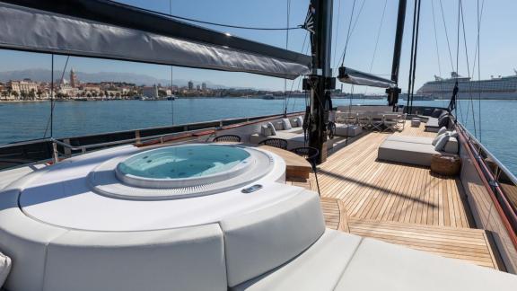 Among Split yacht charter options the 6 cabin 12 guest Scorpios motorsailer features a deck jacuzzi and sunbathing area.