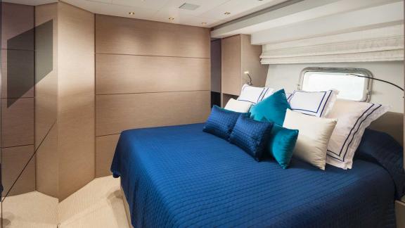 Elegant guest cabin of motor yacht Secundus with luxurious bed, Split, Croatia.