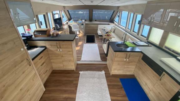 Modern interior of motor yacht Serpil D with spacious living area and kitchen.