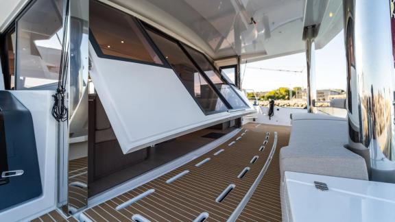 The modern deck of the Bali 5.4 catamaran in Italy offers functionality and style for luxurious experiences at sea.