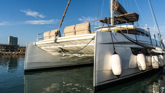 The Bali 5.4 catamaran sits peacefully in an Italian harbor, ready for its next Mediterranean adventure.