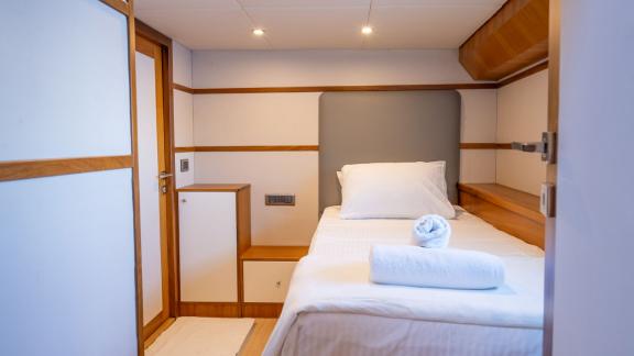 The single cabin on the Gottiri motor yacht features a simple and modern design.