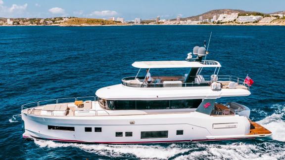 Sirena 64 motor yacht cruising fast and comfortably in open sea.