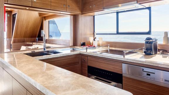 Spacious modern kitchen with sea view on Sirena 64 motor yacht.