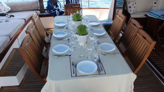 The beautifully set table on the Gulet Life is Life is ready for an elegant meal on board.