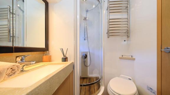 The bathroom of motor yacht Spice of Life II offers modern design and comfortable amenities.