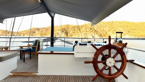 The stylish helm area of Gulet Nayk 2 with comfortable seating and a stunning view.