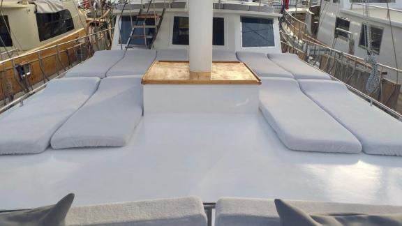 Spacious sun loungers on the foredeck of Gulet Simi, perfect for relaxing and sunbathing while docked.