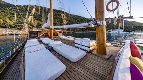 The spacious sun deck of Gulet Golden Life features comfortable sunbeds, perfect for relaxing under the sun.