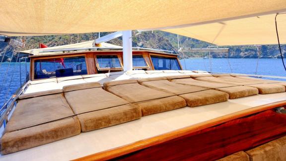 The deck of gulet Sea Angel 2 features a spacious sunbathing area with comfortable cushions.