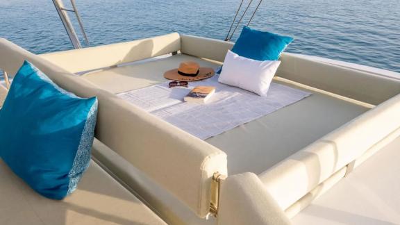 Comfortable relaxation area with pillows on the Sahana catamaran, overlooking the sea. 2/2