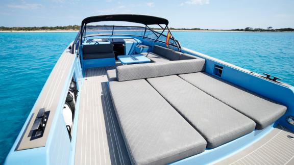 The aft deck of Blue Steel motor yacht offers a comfortable seating area.