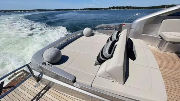 The sunbathing area on the aft deck of motor yacht Urus is furnished with comfortable cushions.