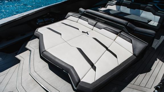 Comfortable sunbathing cushion on the aft deck of the Figo motor yacht.