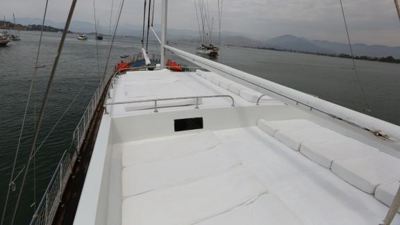 The spacious sun deck of the Gulet Holiday X with 10 cabins in Fethiye, equipped with comfortable sunbathing areas for r